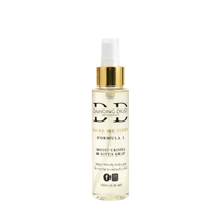 Bottle of 'Dancing Dust' grip product on a white background. Gold collar on spray top.