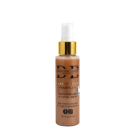 Bottle of 'Dancing Dust' grip product on a white background. Gold collar on spray top.